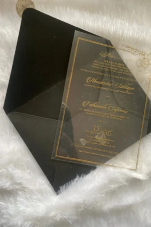 Transparent card with black color envelope and golden color sticker.