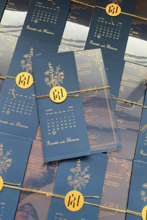 Transparent card with peacock blue color cover and gold paper tag