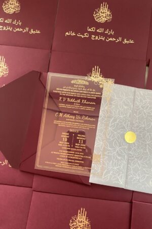 Maroon color envelope with transparent card , buttersheet and golden sticker.