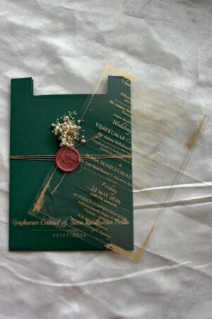 Transparent card with green color cover, wax seal and fresh flower