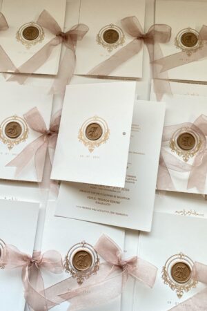 Digital card with offwhite cover, wax seal and bow.